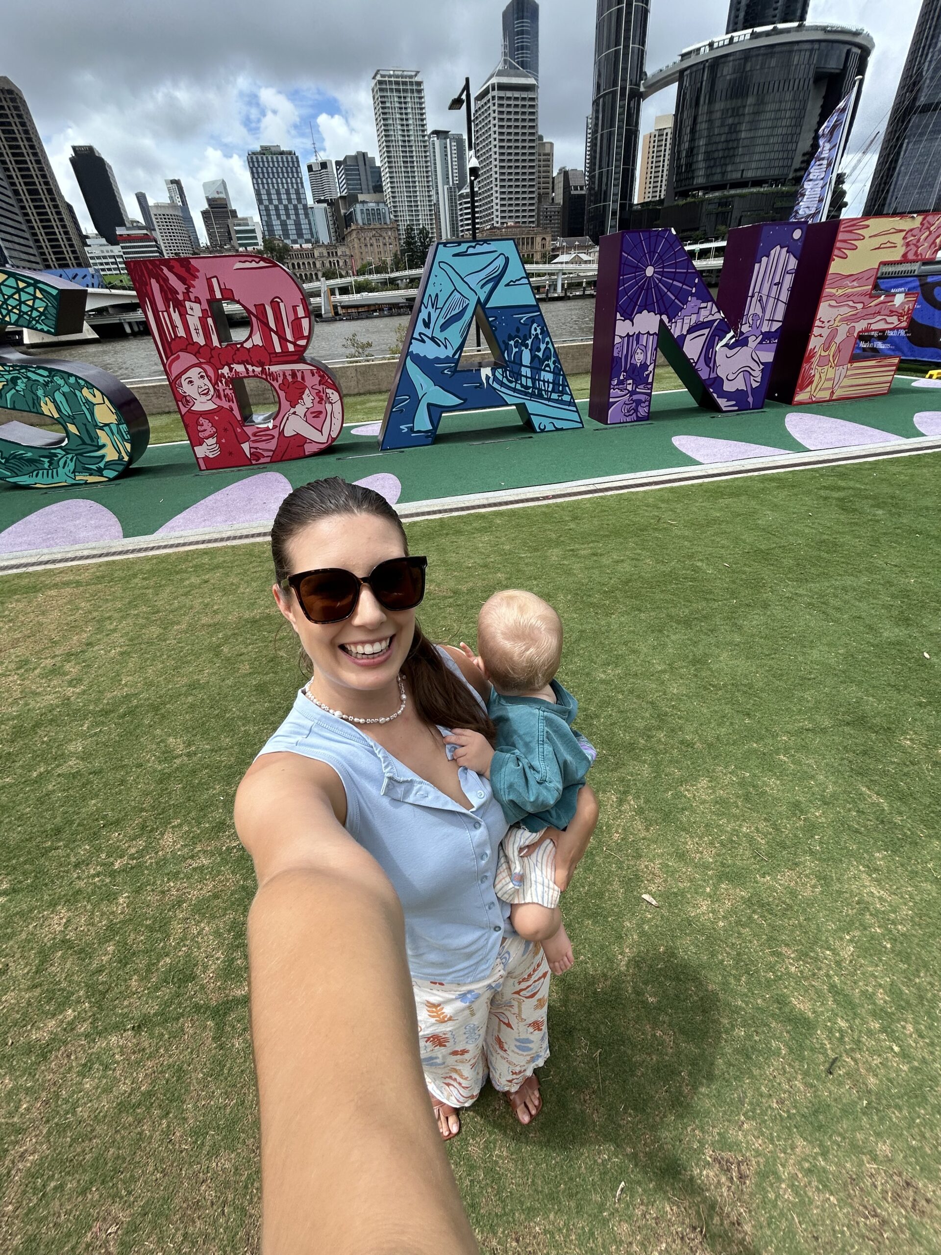 Ashton at the Brisbane sign, baby friendly activity series by Sami Cuff
